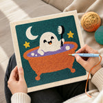 Creating handmade cute ghost taking bubble bath punch needle artwork