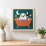 Finished cute ghost taking bubble bath artwork displayed on a wall