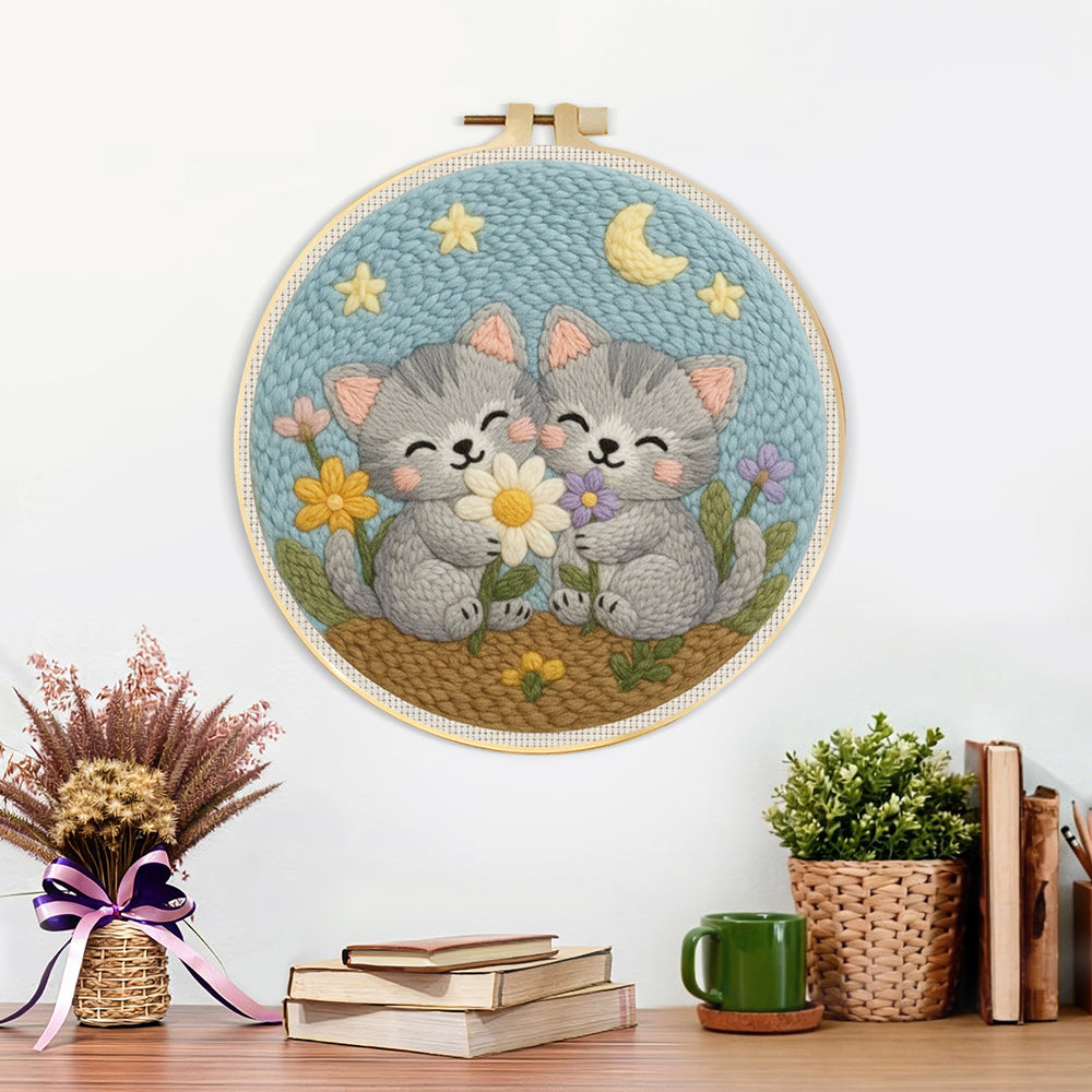 Finished cute gray kittens and wildflowers artwork displayed on a wall