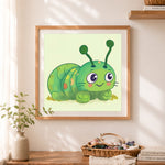 Finished cute green caterpillar cross stitch artwork displayed as home decor