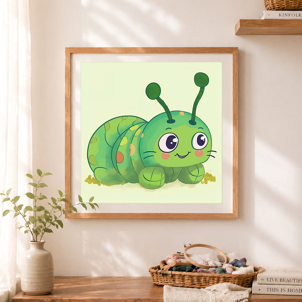 Finished cute green caterpillar cross stitch artwork displayed as home decor