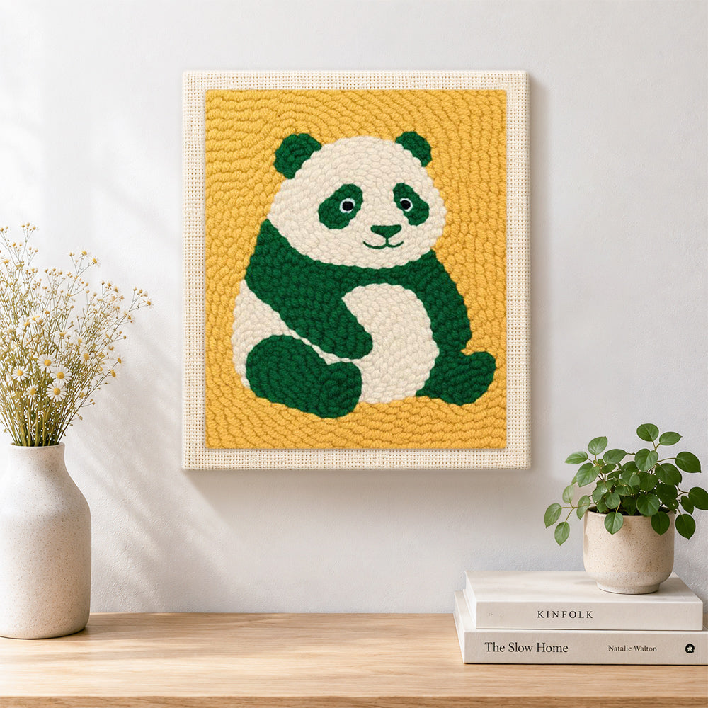 Finished cute green panda artwork displayed on a wall