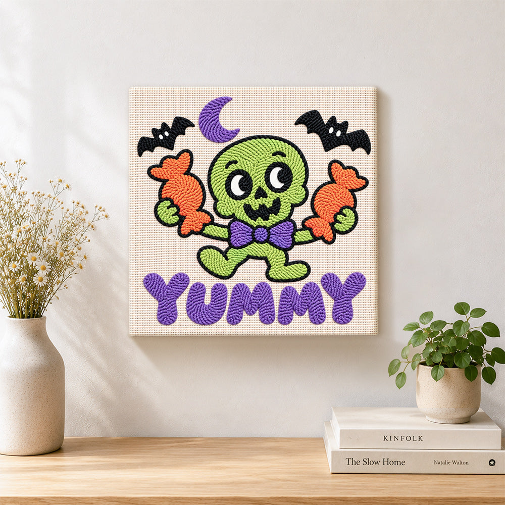 Finished cute green skeleton with candy artwork displayed on a wall