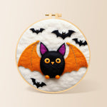 Cute orange-winged bat needle felting kit for beginners with a round wooden frame