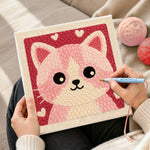 Creating handmade cute pink and white kitten face punch needle artwork