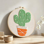 Cute potted twin cactus punch needle artwork displayed on a table