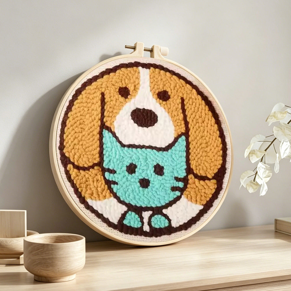 Cute puppy and cat punch needle artwork displayed on a table