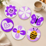 Cute purple bee, flower and butterfly punch needle coasters used for home decoration