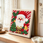 Cute santa portrait punch needle artwork displayed on a table