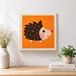 Finished cute side-profile hedgehog artwork displayed on a wall