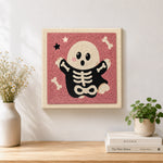 Finished cute skeleton ghost artwork displayed on a wall