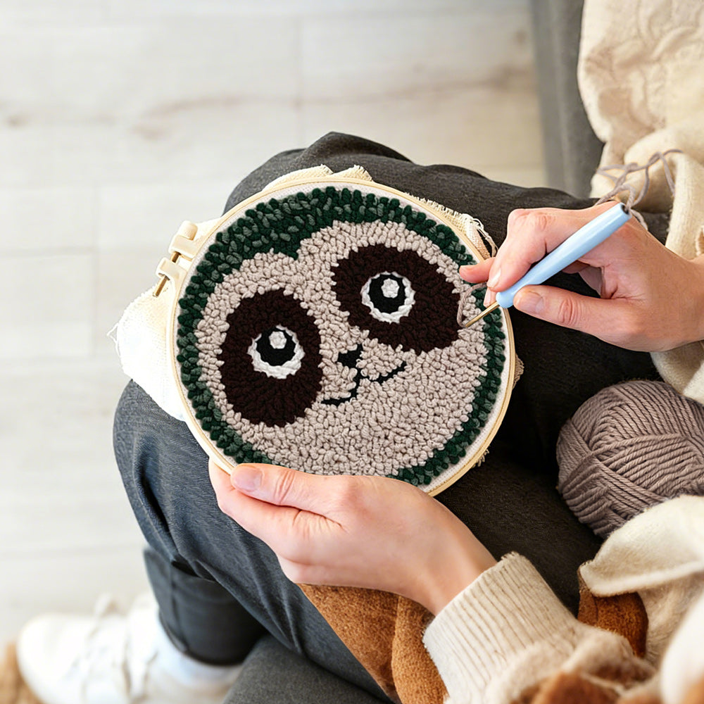 Creating handmade cute sloth face punch needle artwork