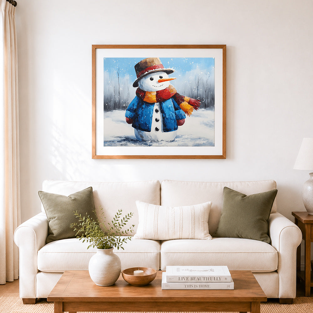 Finished cute snowman in blue coat and scarf cross stitch artwork displayed as home decor