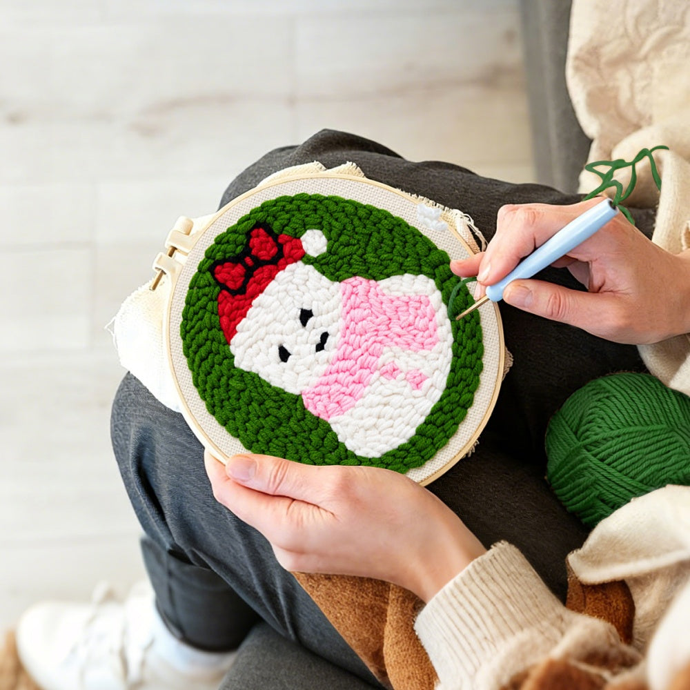Creating handmade cute snowman in santa hat unch needle artwork