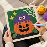 Creating handmade cute spider pumpkin punch needle artwork