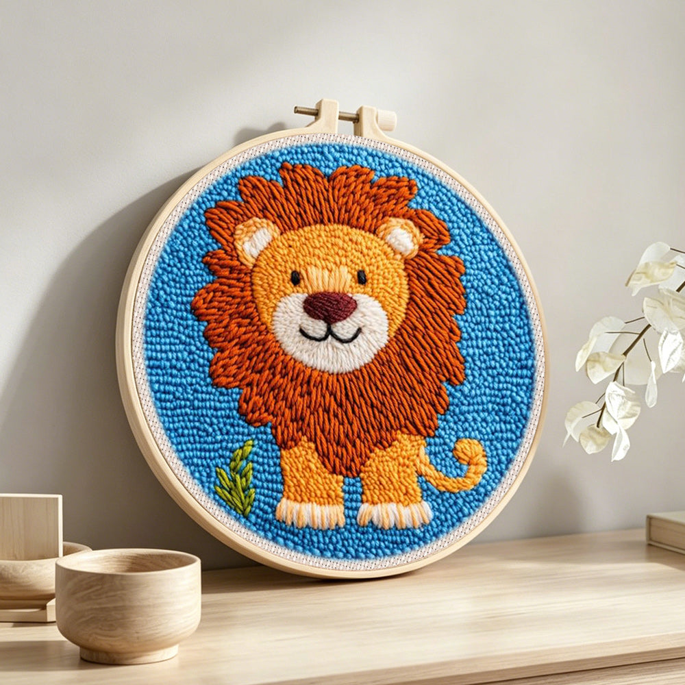 Cute thick-maned lion punch needle artwork displayed on a table