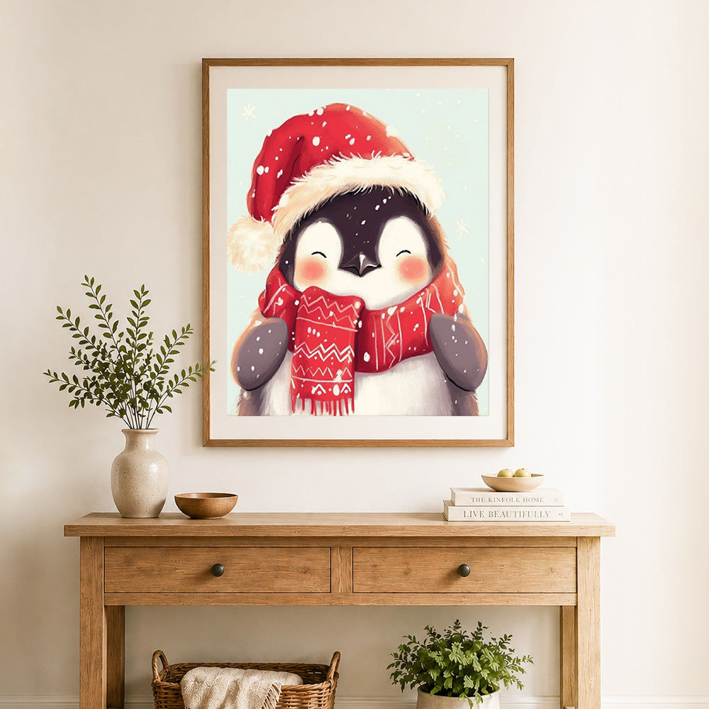Finished cute winter penguin cross stitch artwork displayed as home decor