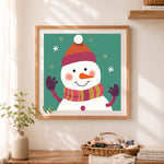 Finished cute winter snowman illustration cross stitch artwork displayed as home decor