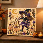 Finished cute witch and broom puppets pearl diamond painting artwork displayed as holiday home decor