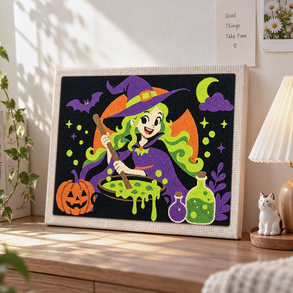 Cute witch making potion punch needle artwork displayed on a table