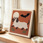 Dachshund ghost disguise punch needle artwork displayed on a table