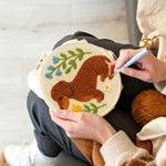 Creating handmade dachshund with flowers punch needle artwork