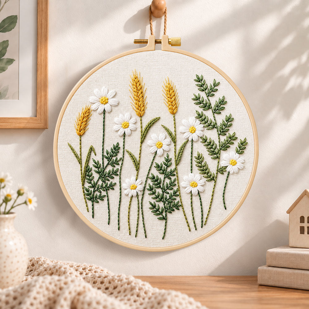 Daisy and wheat embroidery hoop wall art displayed as warm and cozy handmade home decor