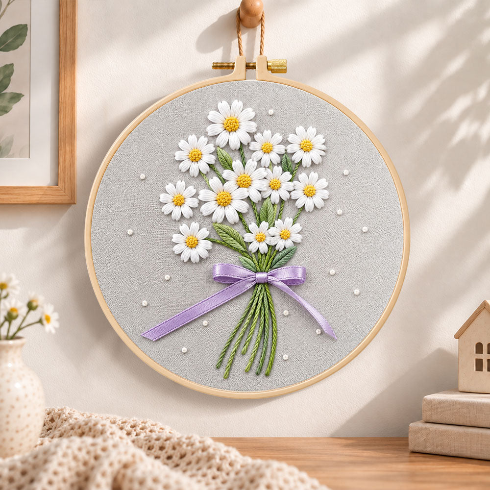 Daisy bouquet with purple ribbon embroidery hoop wall art displayed as warm and cozy handmade home decor