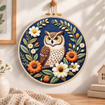 Daisy wreath owl embroidery hoop wall art displayed as warm and cozy handmade home decor
