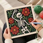 Creating handmade dancing floral skeleton punch needle artwork