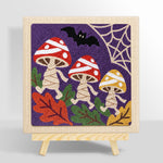 Finished dancing halloween mushrooms artwork displayed on a wall