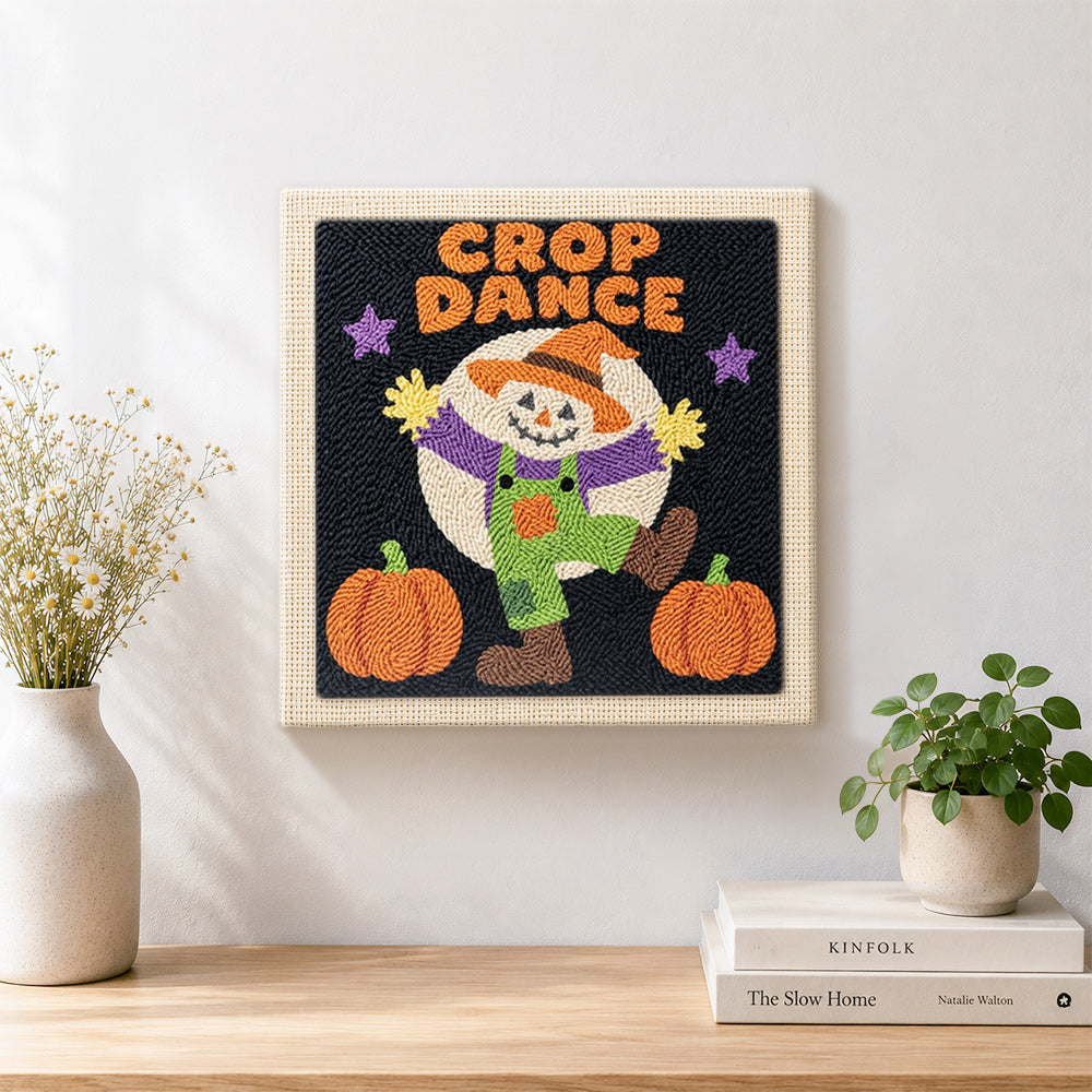 Finished dancing scarecrow under moon artwork displayed on a wall