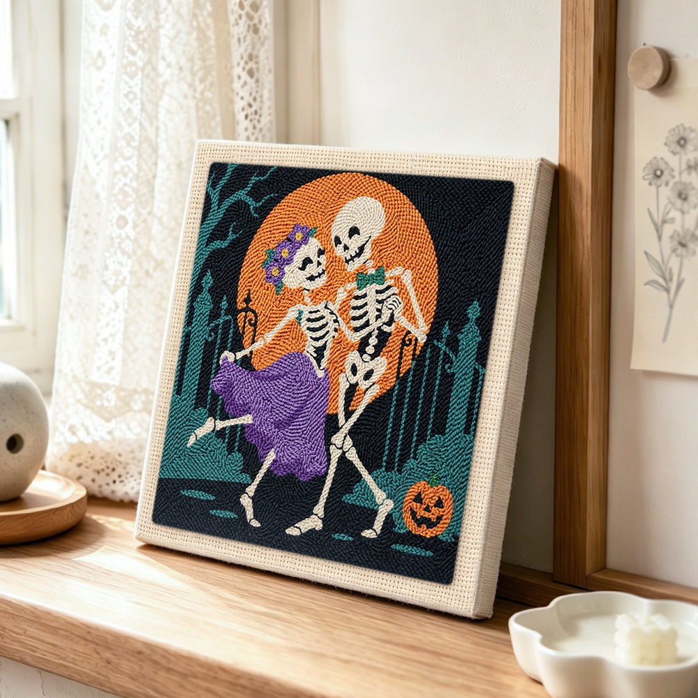 Dancing skeleton couple punch needle artwork displayed on a table