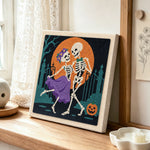Dancing skeleton couple punch needle artwork displayed on a table