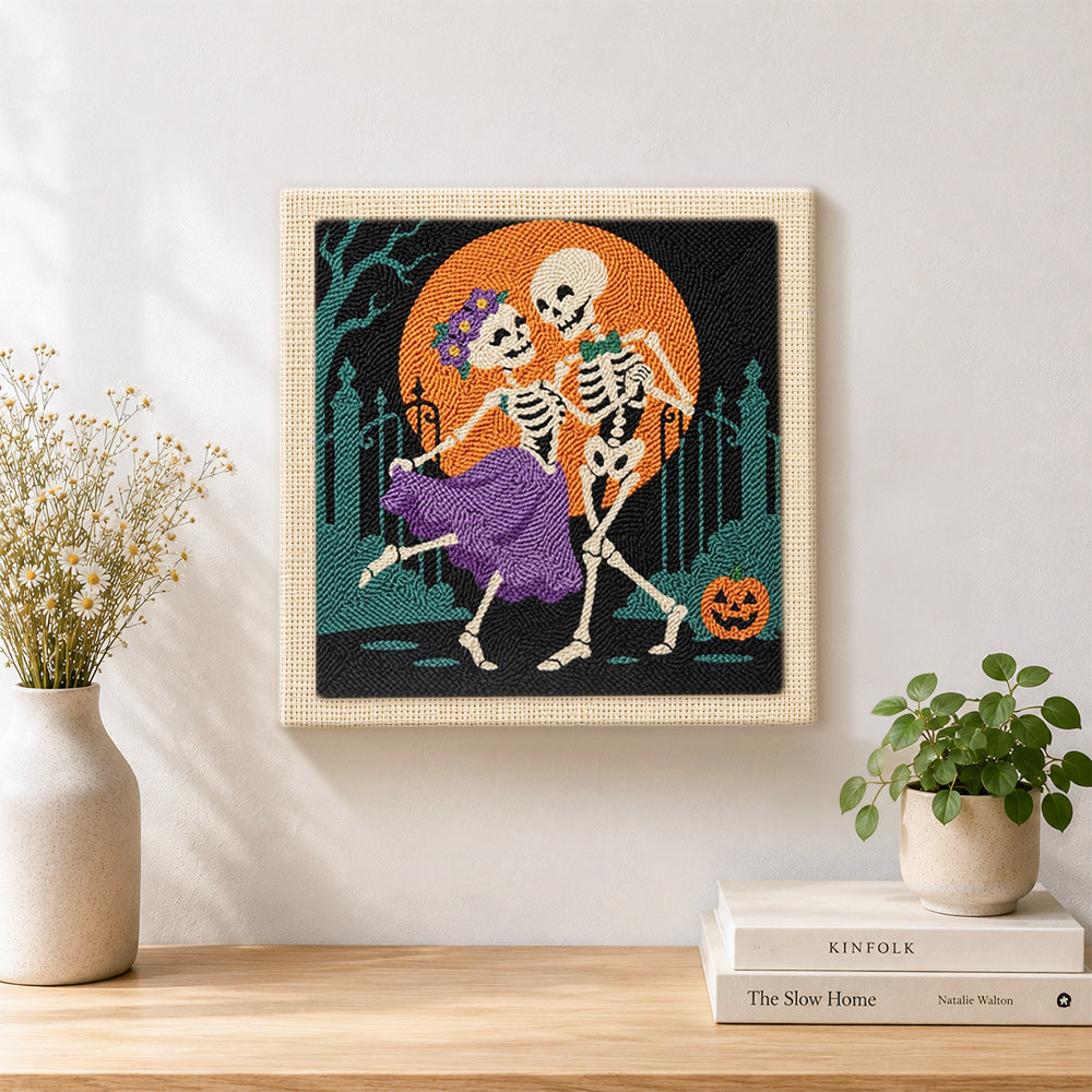 Finished dancing skeleton couple artwork displayed on a wall