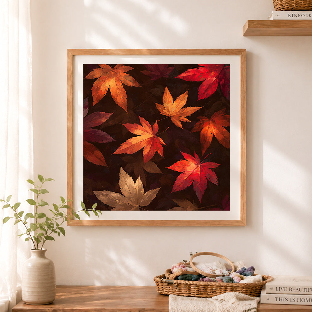 Finished dark autumn maple leaves cross stitch artwork displayed as home decor