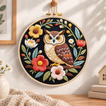 Dark floral owl embroidery hoop wall art displayed as warm and cozy handmade home decor