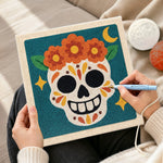 Creating handmade day of dead floral skull punch needle artwork