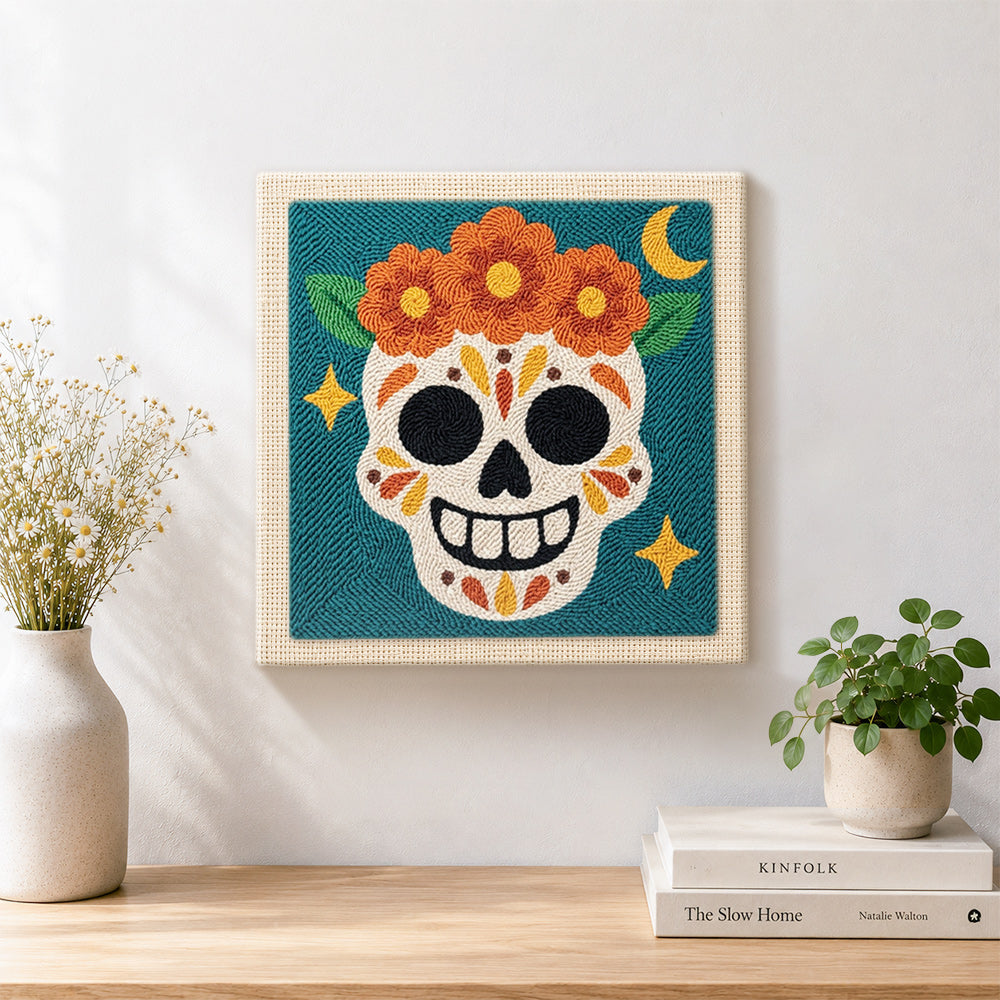 Finished day of dead floral skull artwork displayed on a wall