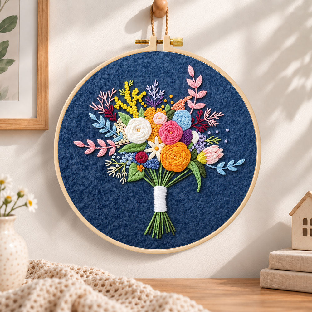 Deep blue mixed flower bouquet embroidery hoop wall art displayed as warm and cozy handmade home decor