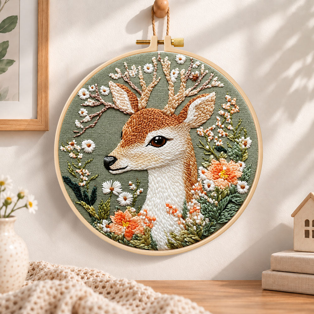 Deer and wild daisies embroidery hoop wall art displayed as warm and cozy handmade home decor