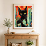 Finished desert black cat cross stitch artwork displayed as home decor