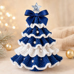 DIY Crochet Christmas Tree Kit in blue and white with layered crochet details, pearl decorations and a festive bow
