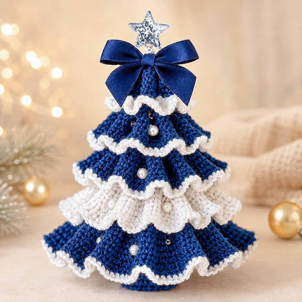 DIY Crochet Christmas Tree Kit in blue and white with layered crochet details, pearl decorations and a festive bow