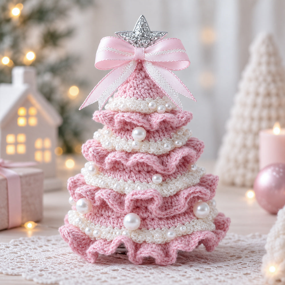 DIY Crochet Christmas Tree Kit in pink and white with layered crochet details, pearl decorations and a festive bow