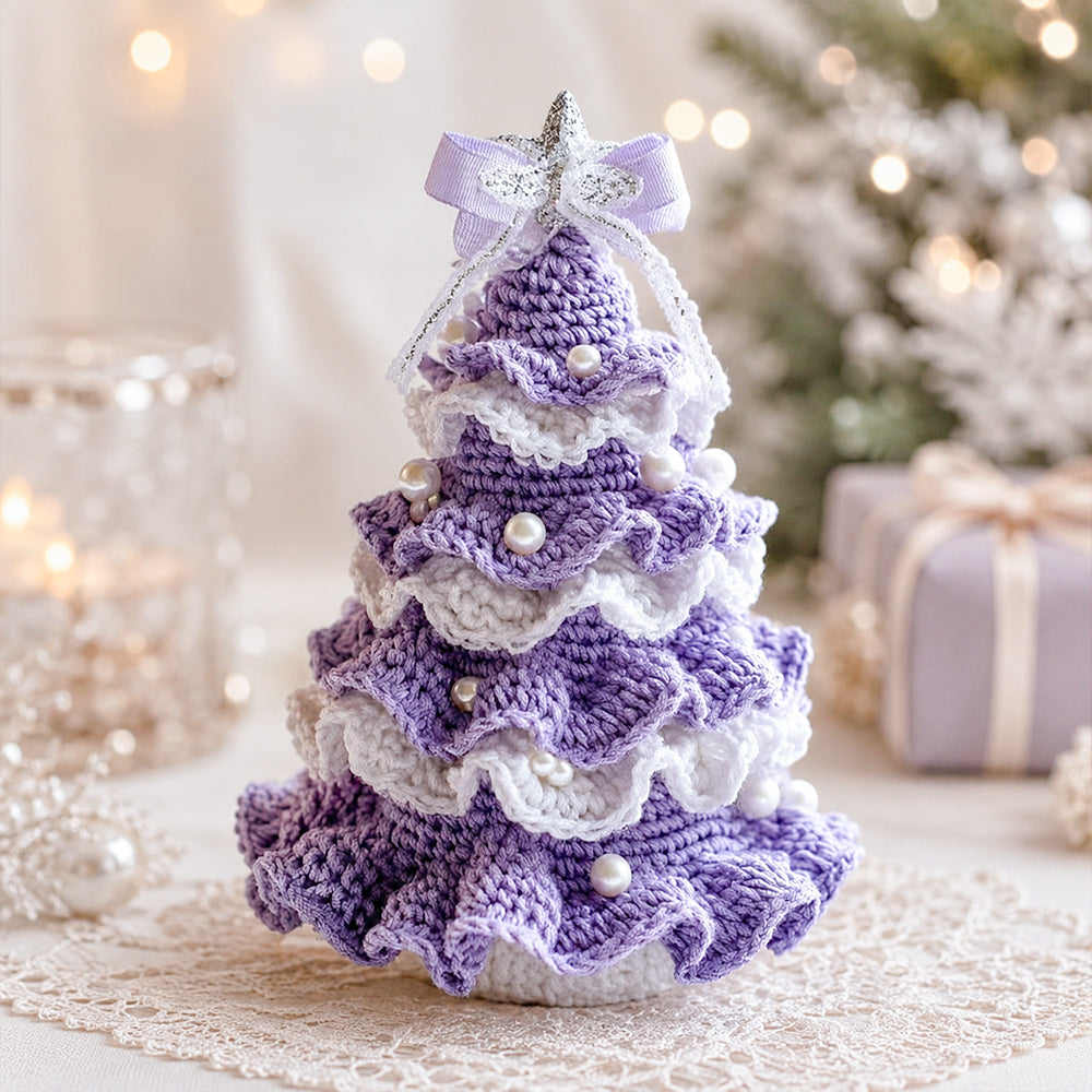 DIY Crochet Christmas Tree Kit in purple and white with layered crochet details, pearl decorations and a festive bow