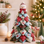 DIY quilted Christmas tree kit with snowman topper and red blue green winter fabric