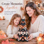 Mother and daughter enjoying a DIY quilted Halloween tree kit craft together