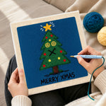 Creating handmade dizzy eyes xmas tree punch needle artwork