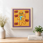 Finished dizzy gingerbread man artwork displayed on a wall